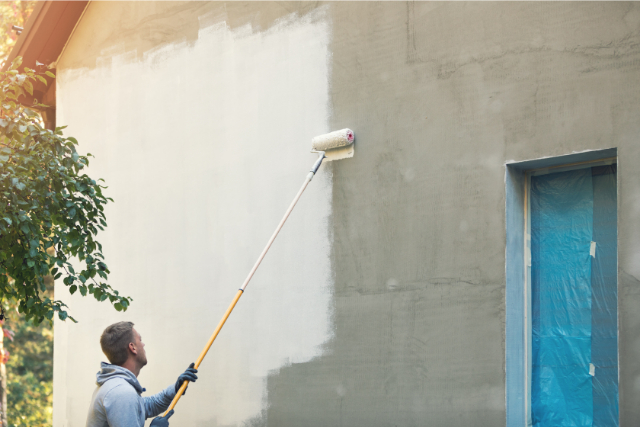 Exterior house painter with roller