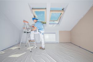 Worker Repainting Interior of a Home